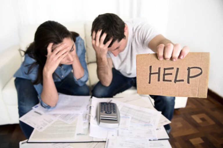 young couple experiencing the signs of financial stress seeking help for financial relief