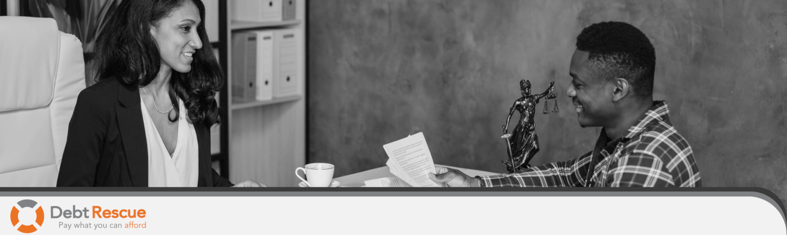 A couple discussing if they have too much debt and might need debt help realising debt rescue could be the path to financial freedom