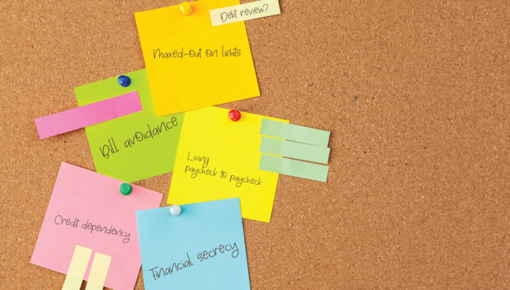 Post-its with debt review and other financial written on it